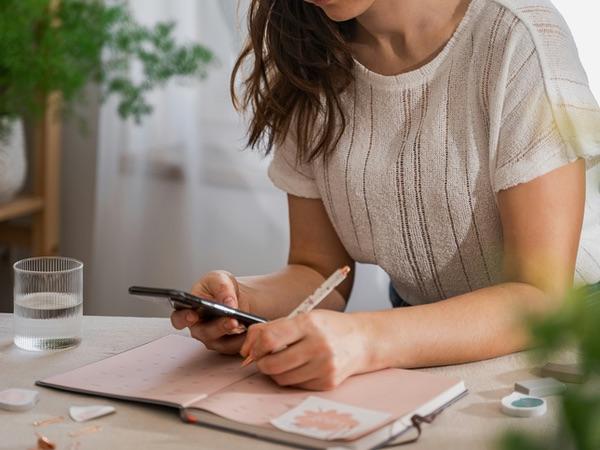 Woman writing a todo list